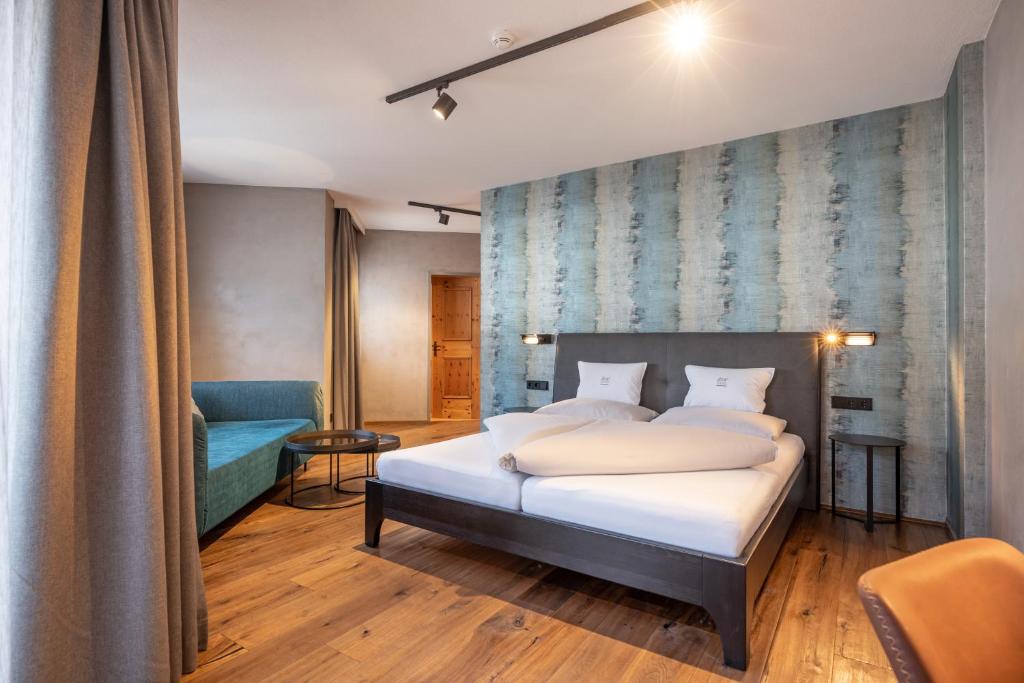 Postel nebo postele na pokoji v ubytování Familienparadies Sporthotel Achensee - FAMILIES ONLY