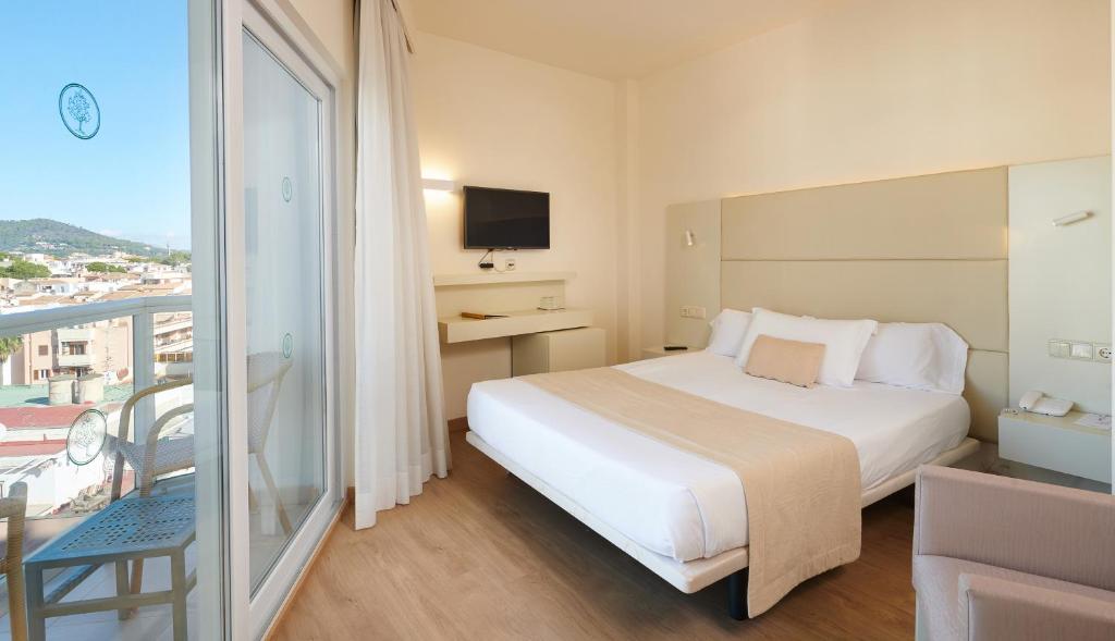 Postel nebo postele na pokoji v ubytování Hotel Sabina