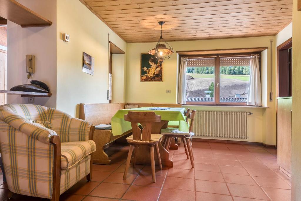 a living room with a couch and a table at Pension Sonia App 102 in Funes