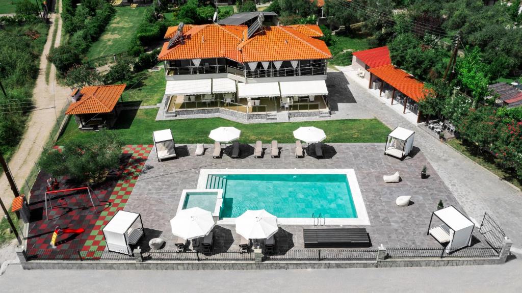 an aerial view of a house with a swimming pool at 4-you Residence in Agios Nikolaos