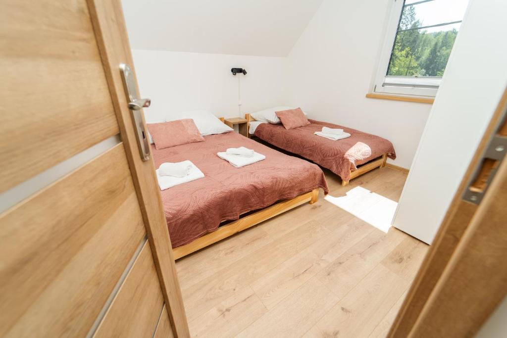 Postel nebo postele na pokoji v ubytování ApartView House Dolina Partecznik by Rent like home