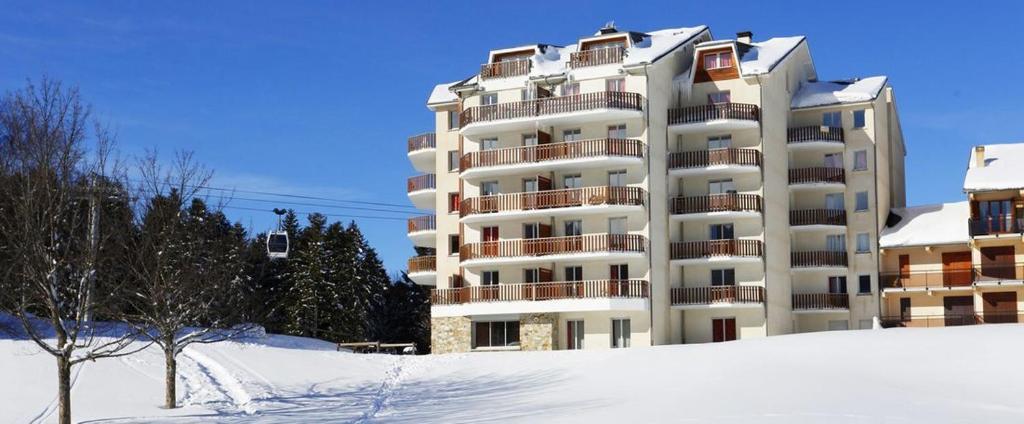 a large apartment building with snow in front of it at T3 - 6 PERS - PIEDS DES PISTES + PISCINE BALCON in Ax-les-Thermes