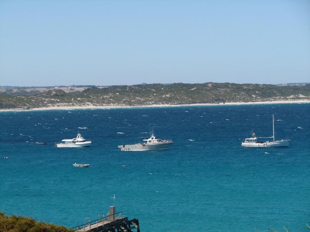 a group of boats in a large body of water at Koopalanda Dreaming in Vivonne Bay