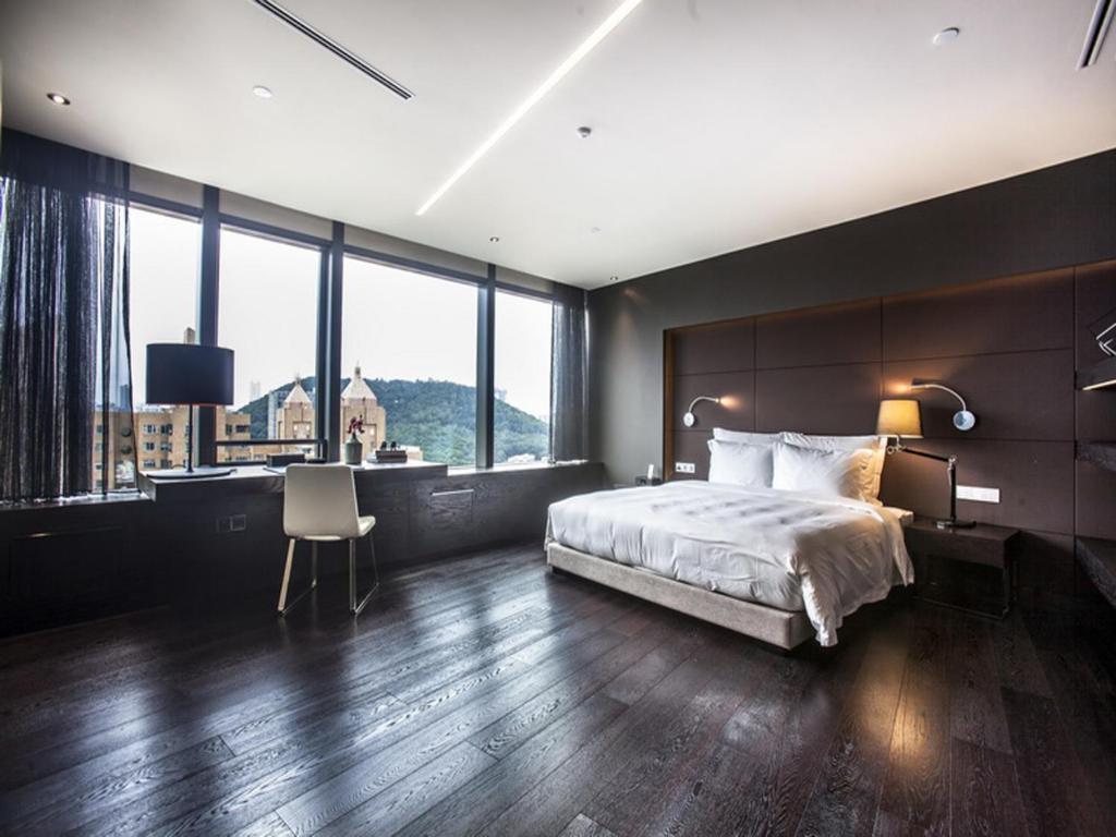 Postel nebo postele na pokoji v ubytování Shenzhen O Hotel