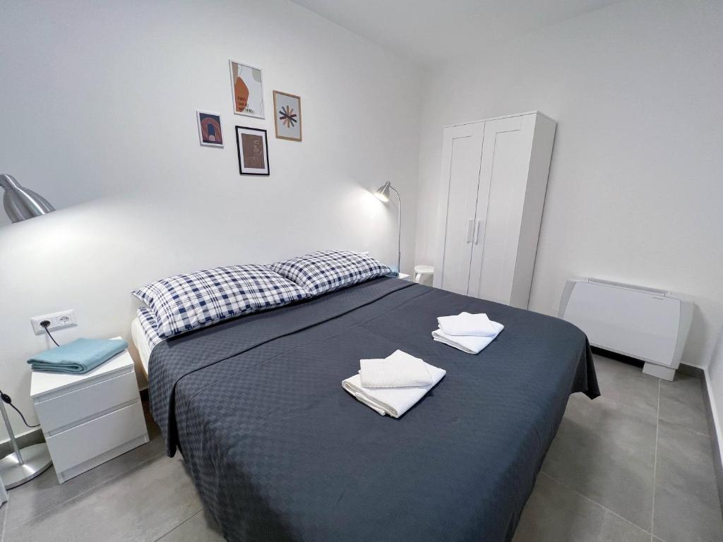 Postel nebo postele na pokoji v ubytování Lujza Apartman