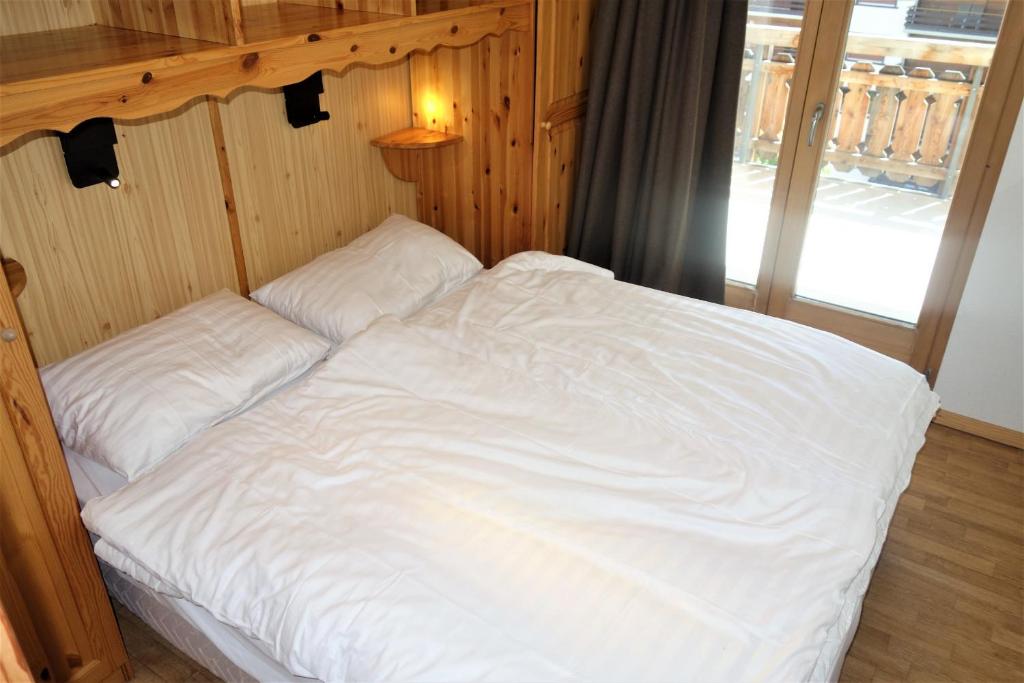 Postel nebo postele na pokoji v ubytování Pracondu OUTDOOR & FUN appartement 1 chambre avec balcon by Alpvision Résidences