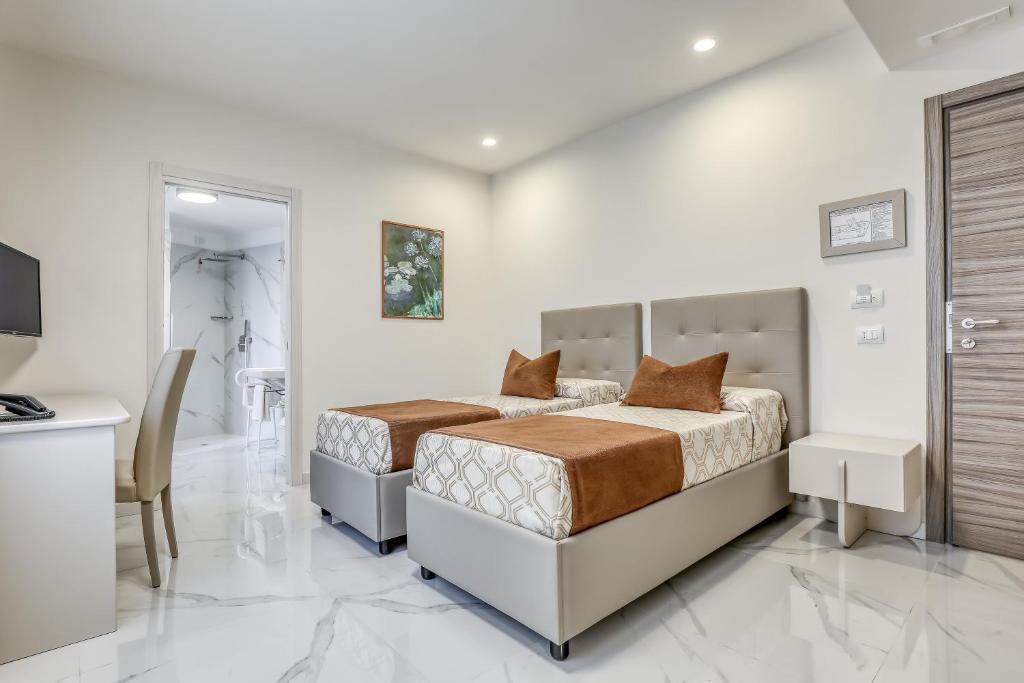 Posteľ alebo postele v izbe v ubytovaní Vomero High Hotel