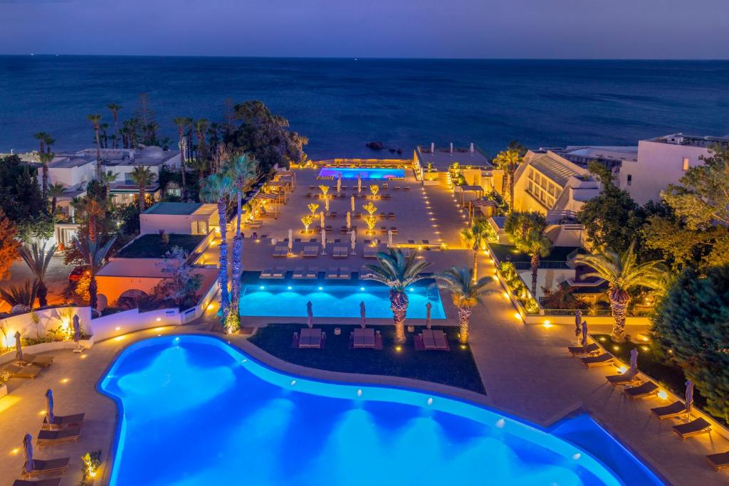an aerial view of a resort pool at night at Royal Azur Thalassa in Hammamet