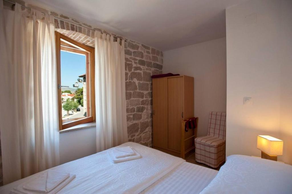 Posteľ alebo postele v izbe v ubytovaní Rotondo Apartments