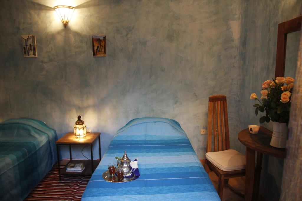 Postel nebo postele na pokoji v ubytování Riad Azenzer