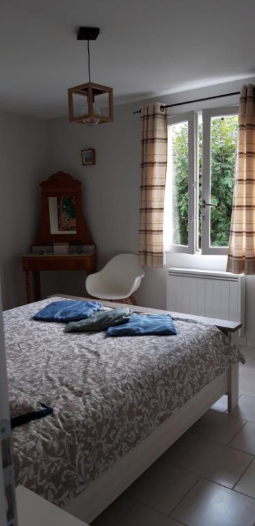 Postel nebo postele na pokoji v ubytování Les Ondines