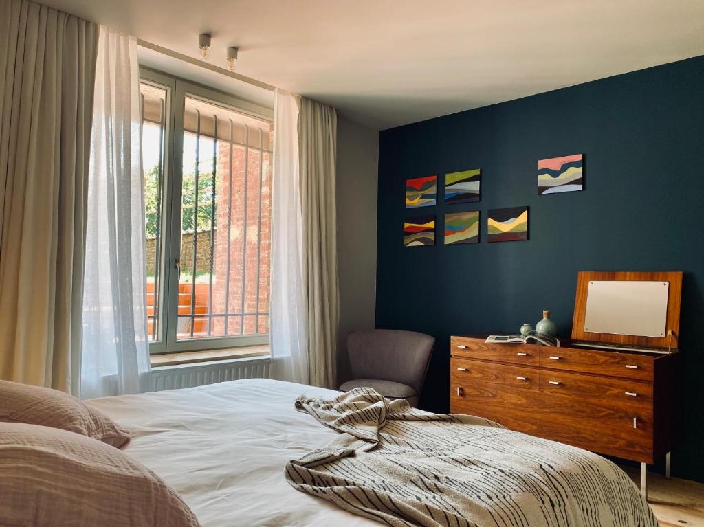 Postel nebo postele na pokoji v ubytování Maison Henri Namur