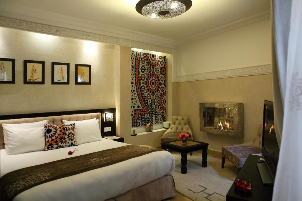 Postel nebo postele na pokoji v ubytování Riad Monceau