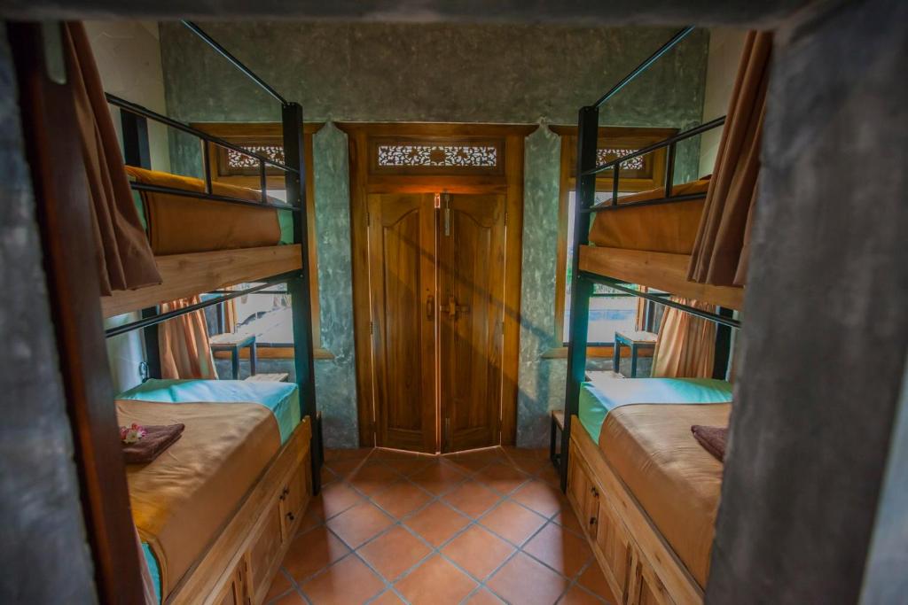 Postel nebo postele na pokoji v ubytování Black Pearl Hostel
