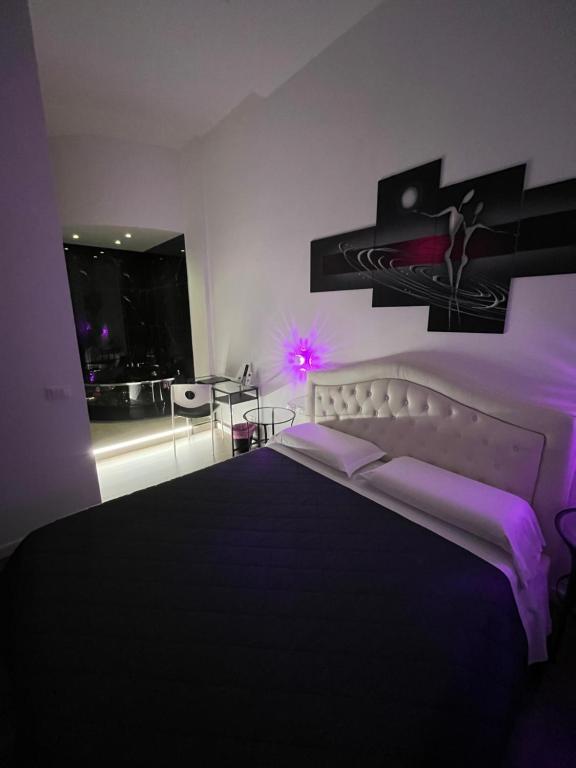 En eller flere senge i et værelse på Domus Flavia B&B