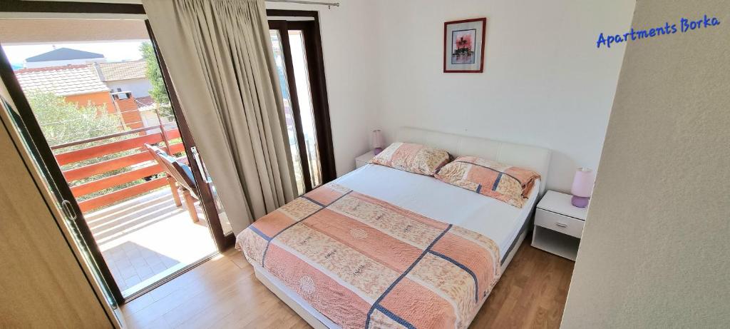 Posteľ alebo postele v izbe v ubytovaní Apartments Borka