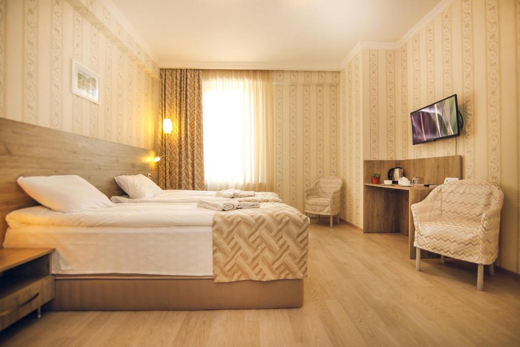 Postel nebo postele na pokoji v ubytování Hotel Kera