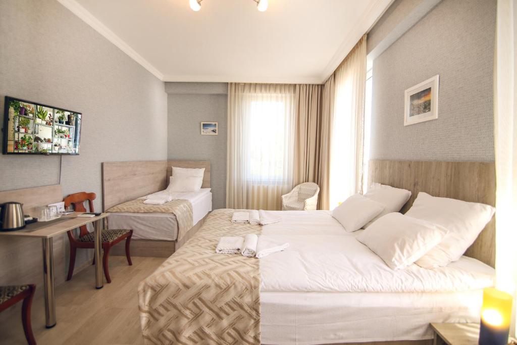 Postel nebo postele na pokoji v ubytování Hotel Kera