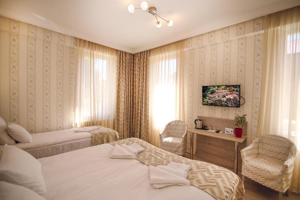 Postel nebo postele na pokoji v ubytování Hotel Kera