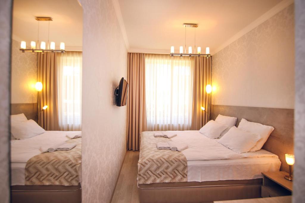 Postel nebo postele na pokoji v ubytování Hotel Kera