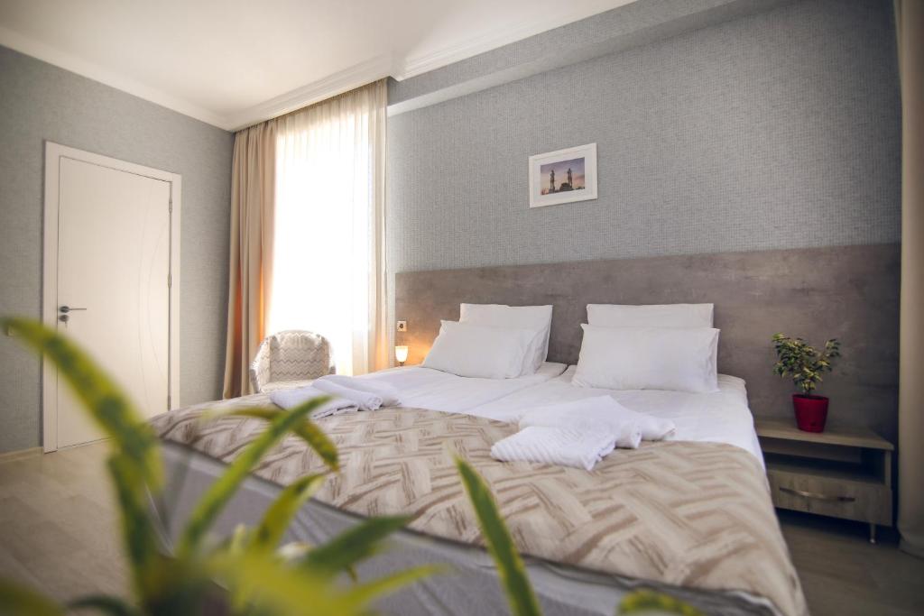 Postel nebo postele na pokoji v ubytování Hotel Kera