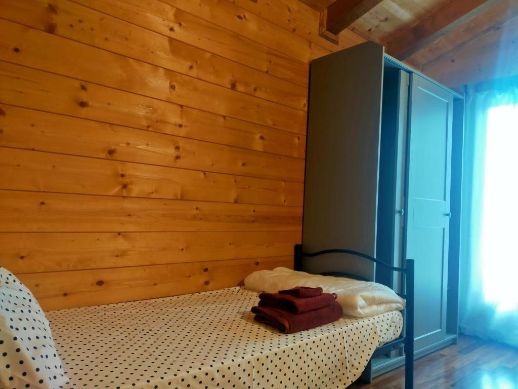 Letto o letti in una camera di Chalet Collalto con Piscina