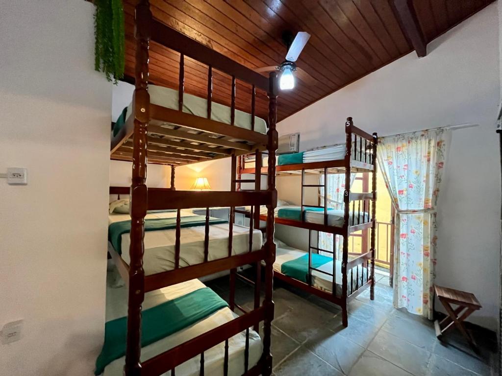 Postel nebo postele na pokoji v ubytování Hostel Papagaio