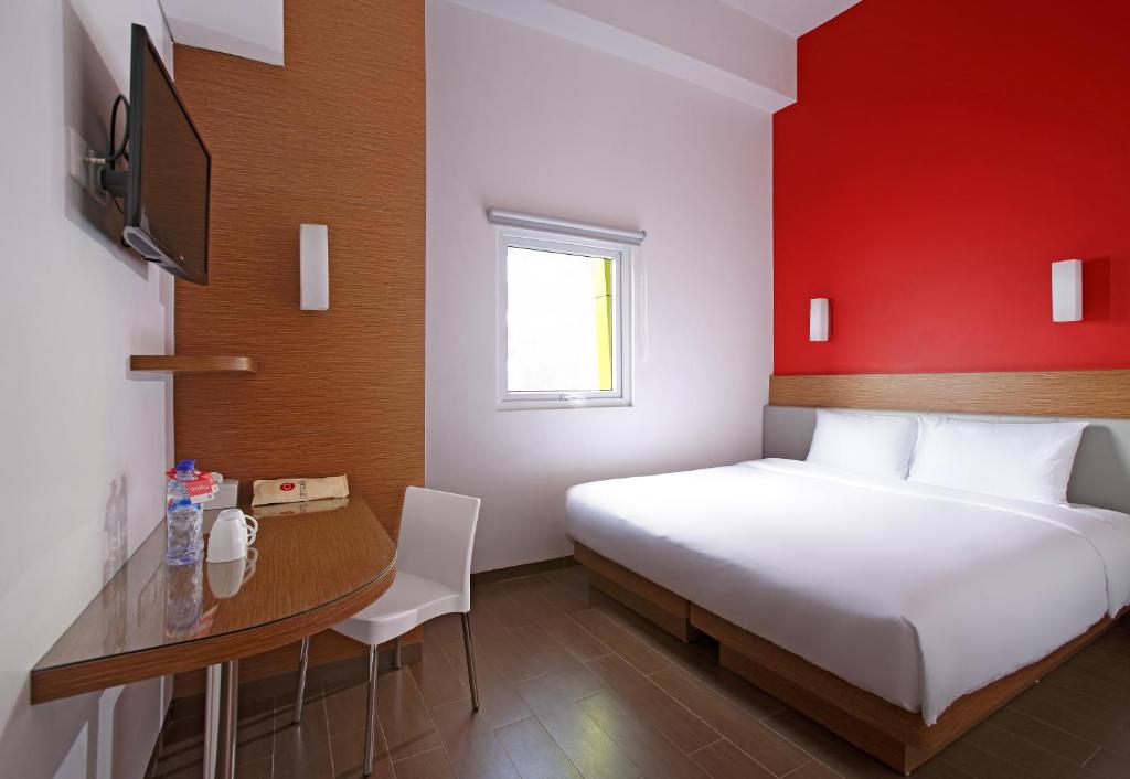 Postel nebo postele na pokoji v ubytování Amaris Hotel Cilegon