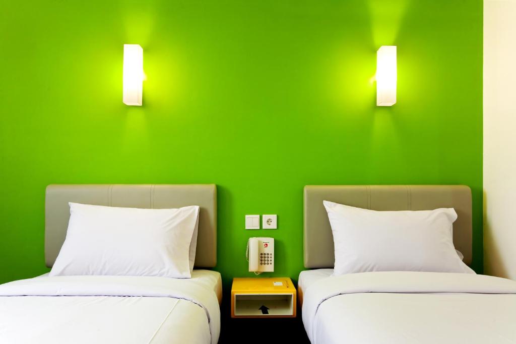 Postel nebo postele na pokoji v ubytování Amaris Hotel Cilegon