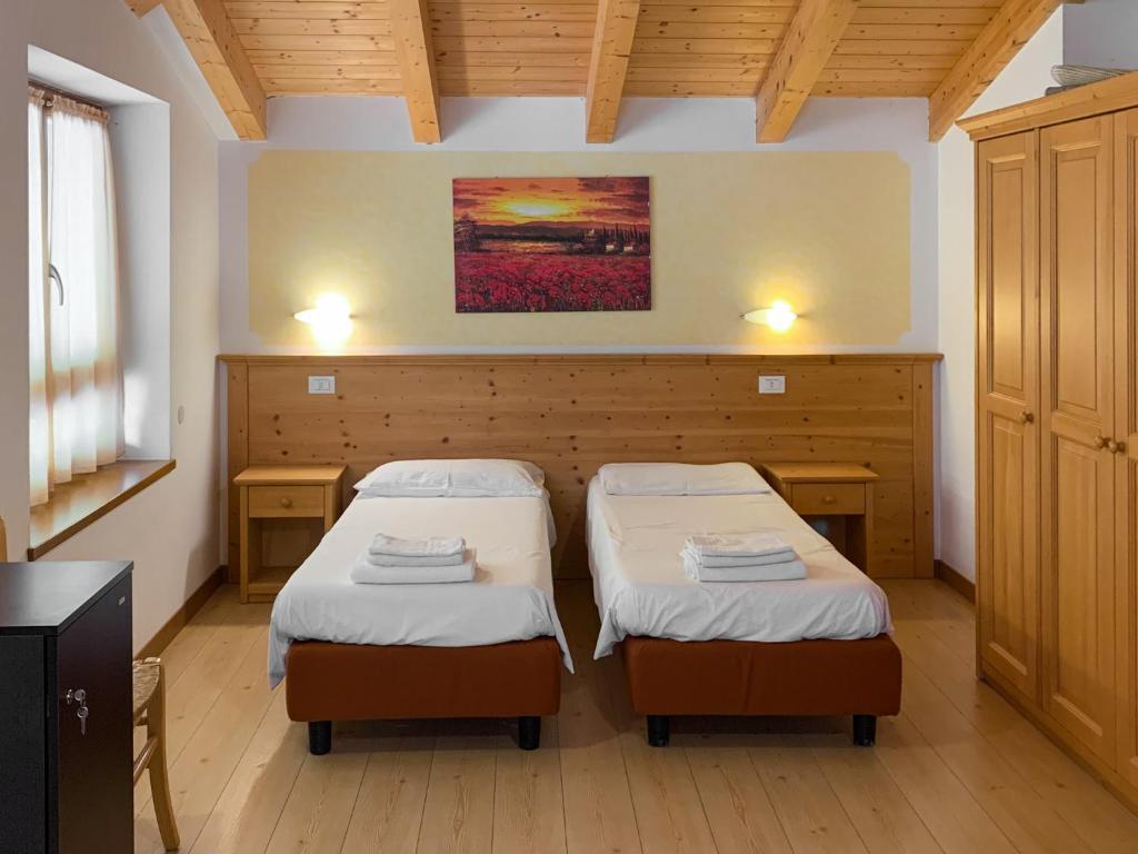 Postel nebo postele na pokoji v ubytování Agritur al Vigneto