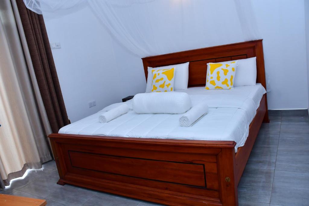 Postel nebo postele na pokoji v ubytování Dilshan Cottage