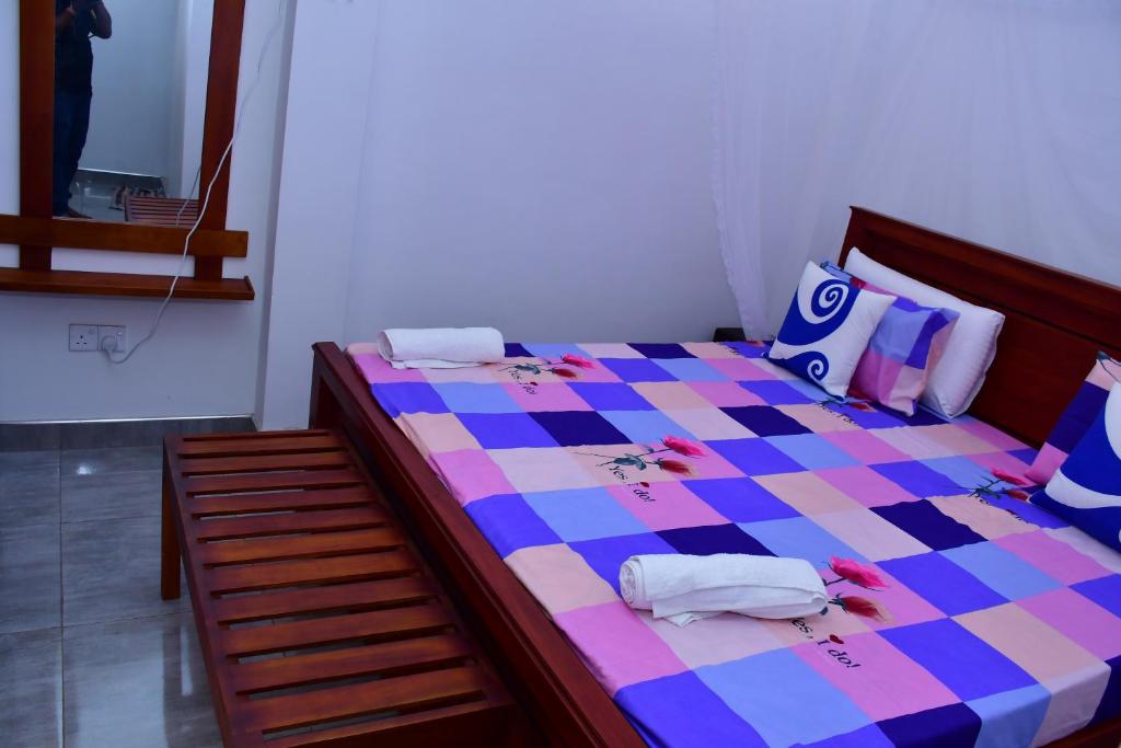 Postel nebo postele na pokoji v ubytování Dilshan Cottage