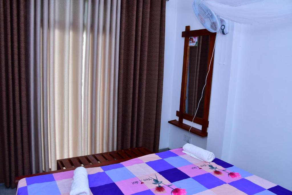 Postel nebo postele na pokoji v ubytování Dilshan Cottage