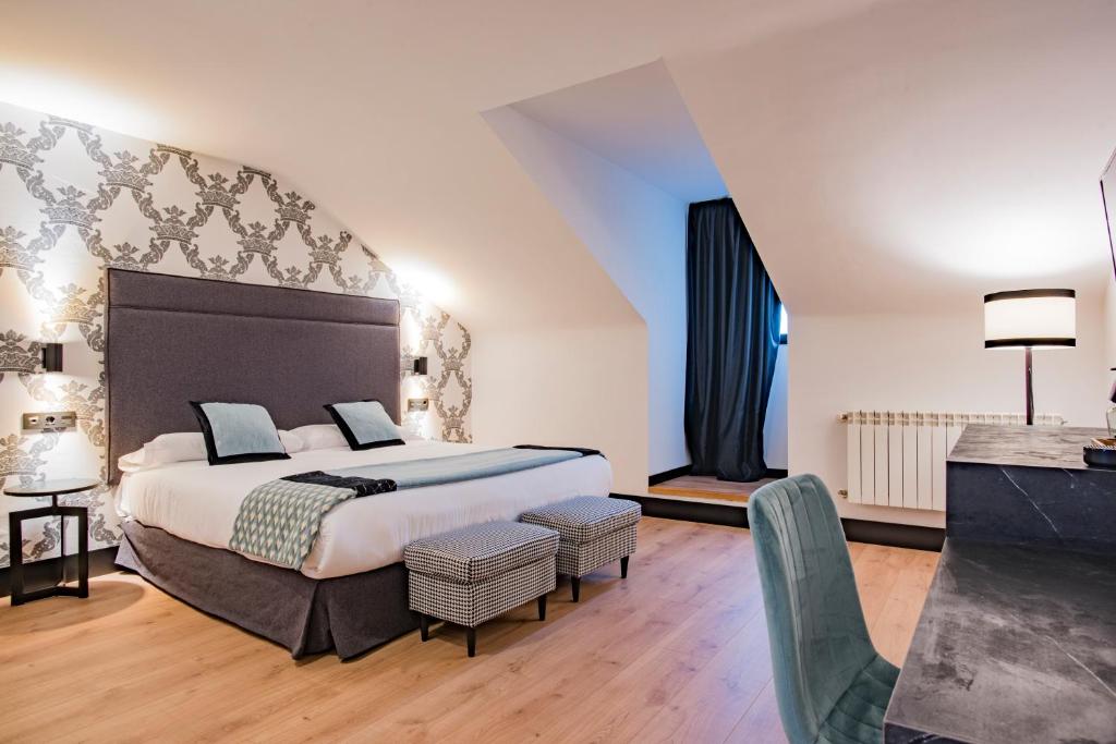 Postel nebo postele na pokoji v ubytování Hotel Mirador de la Cepada