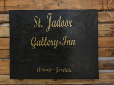 a black sign that says st jordan gallery jam at St.Jadoor Inn in Al Azraq ash Shamālī