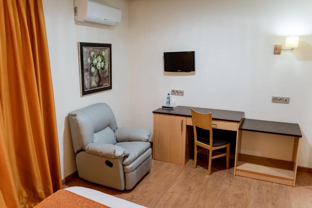 TV a/nebo společenská místnost v ubytování Hotel Malena