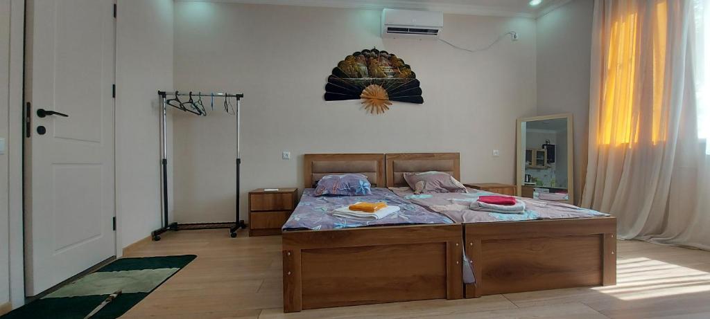 a bedroom with a bed with food on it at Cozy House III in Tbilisi City