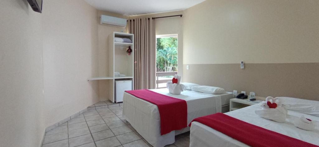 Cama ou camas em um quarto em Caldas Park & Hotel XPTO Turismo