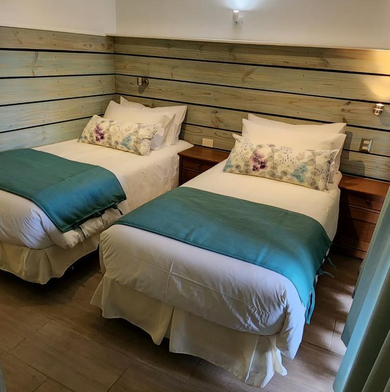 Postel nebo postele na pokoji v ubytování Apart Hotel Rapa Nui