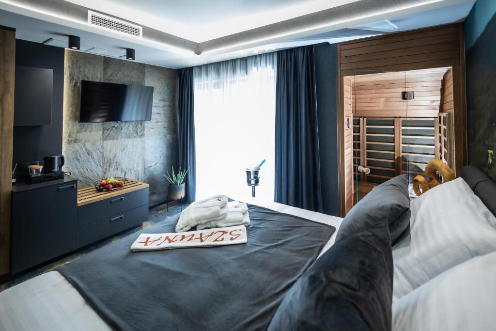 Posteľ alebo postele v izbe v ubytovaní 4 Évszak Erdeihotel**** - Mátrafüred