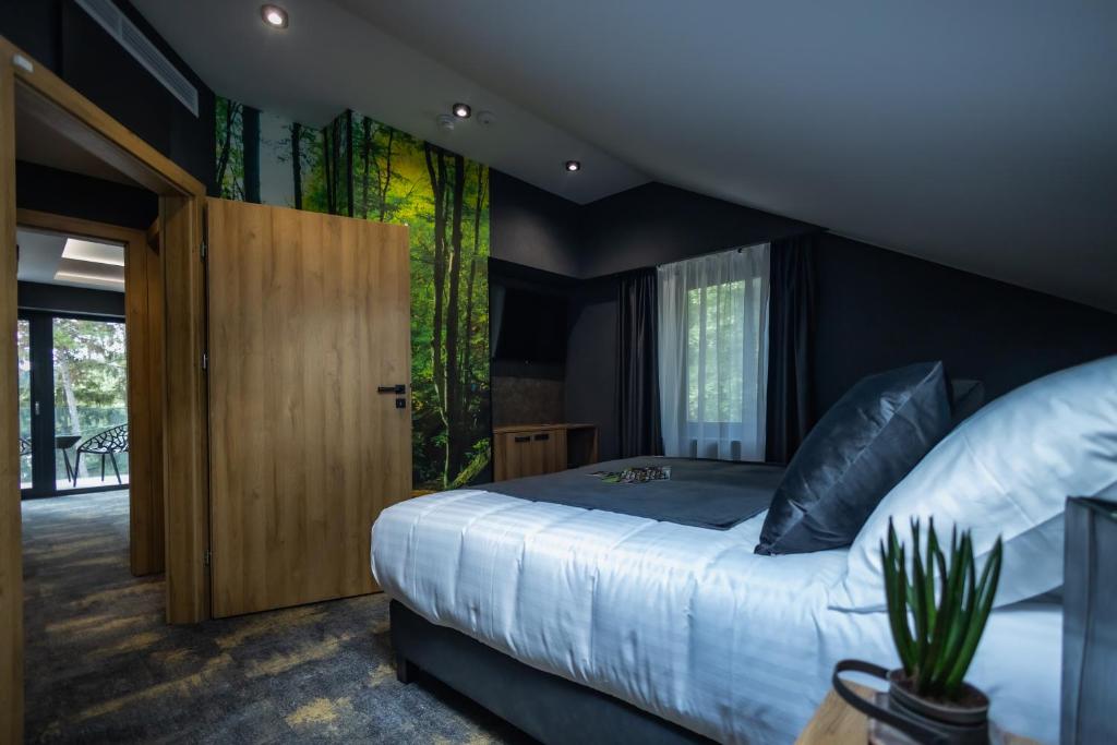 Posteľ alebo postele v izbe v ubytovaní 4 Évszak Erdeihotel**** - Mátrafüred