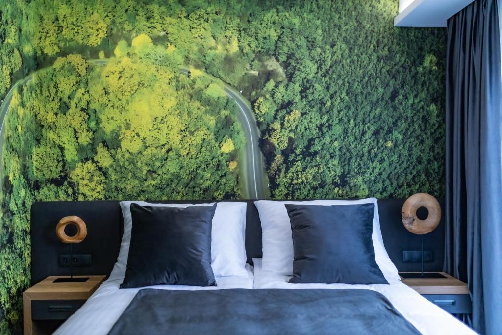 Posteľ alebo postele v izbe v ubytovaní 4 Évszak Erdeihotel**** - Mátrafüred