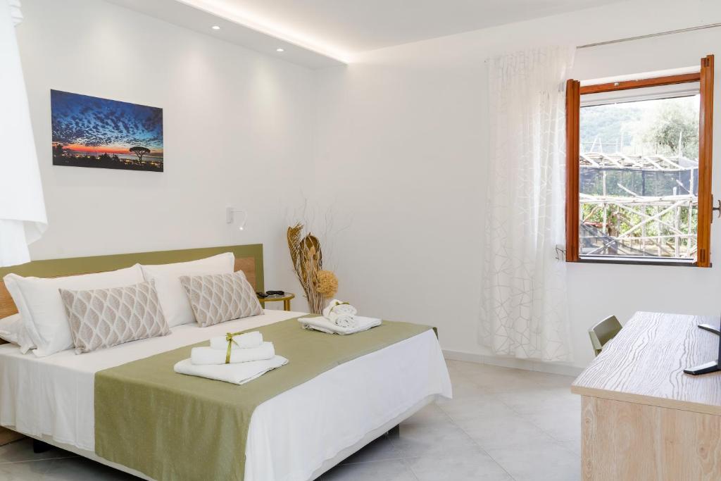 A bed or beds in a room at La Pigna Sorrento