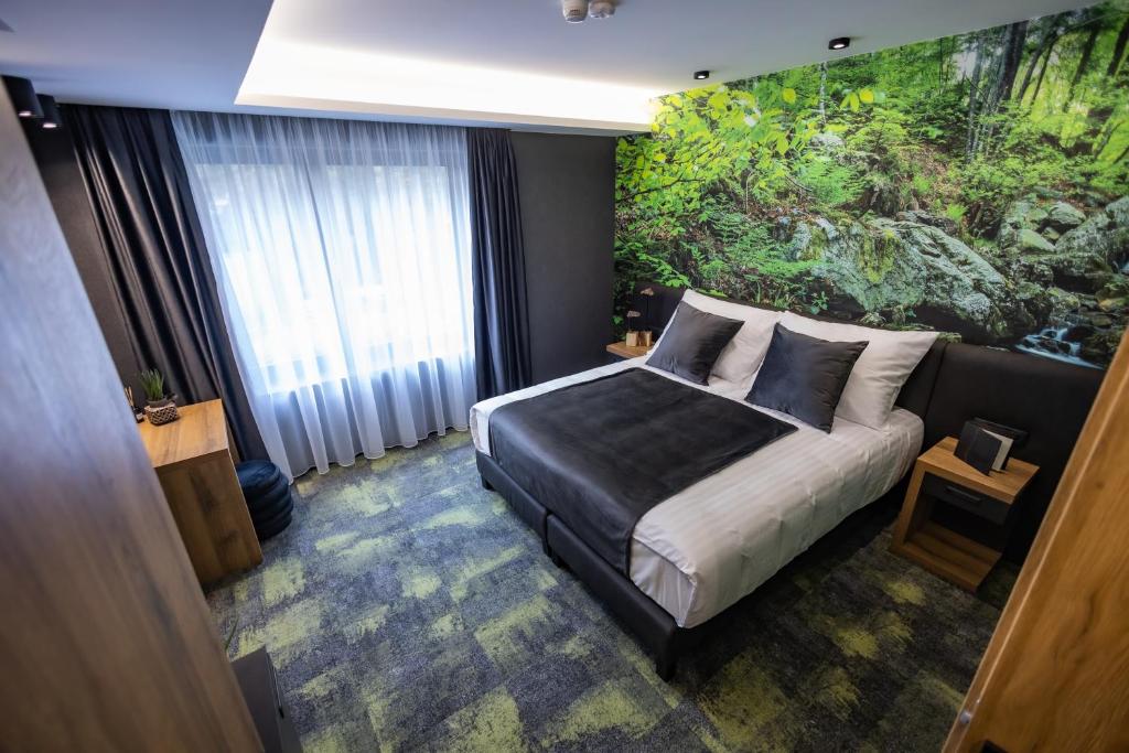 Posteľ alebo postele v izbe v ubytovaní 4 Évszak Erdeihotel**** - Mátrafüred