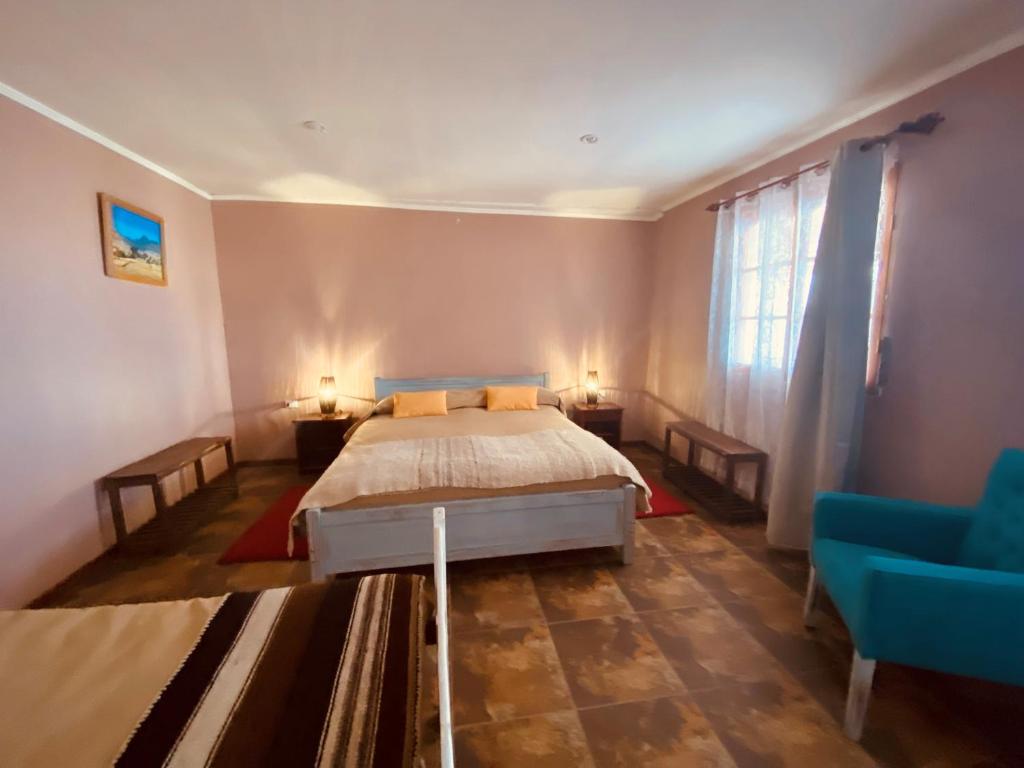 Postel nebo postele na pokoji v ubytování Hostal Katari
