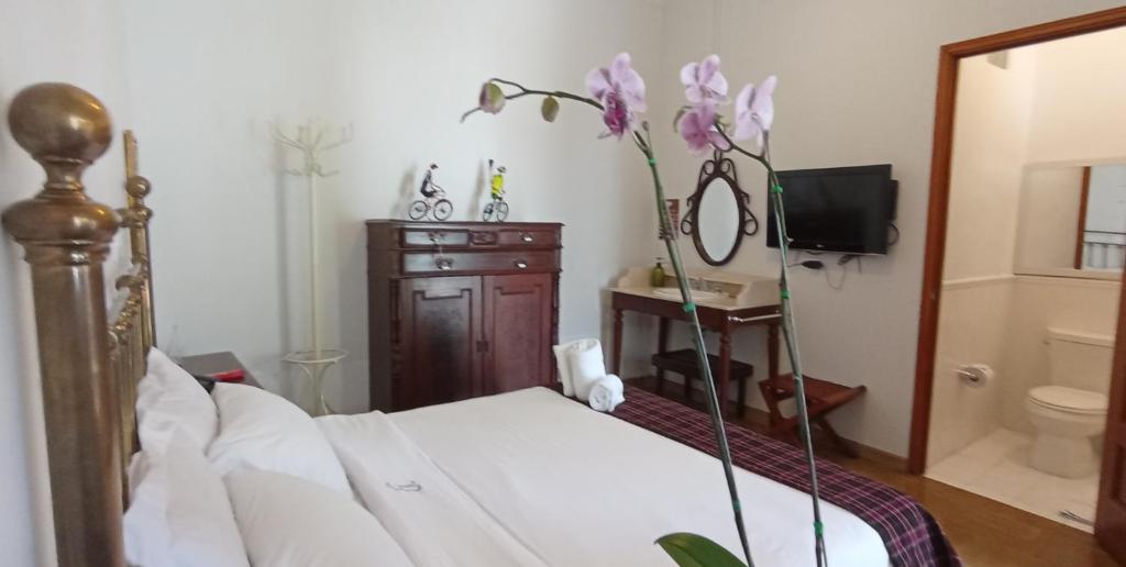 Postel nebo postele na pokoji v ubytování Hotel Don Alfonso