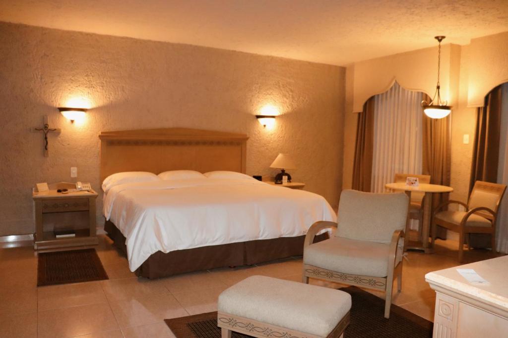 Postel nebo postele na pokoji v ubytování Suites Layfer, Córdoba, Veracruz, México