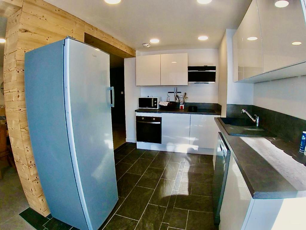 Kuchyň nebo kuchyňský kout v ubytování Appartement spacieux 300m2 - Sauna - BBQ - Terrasse