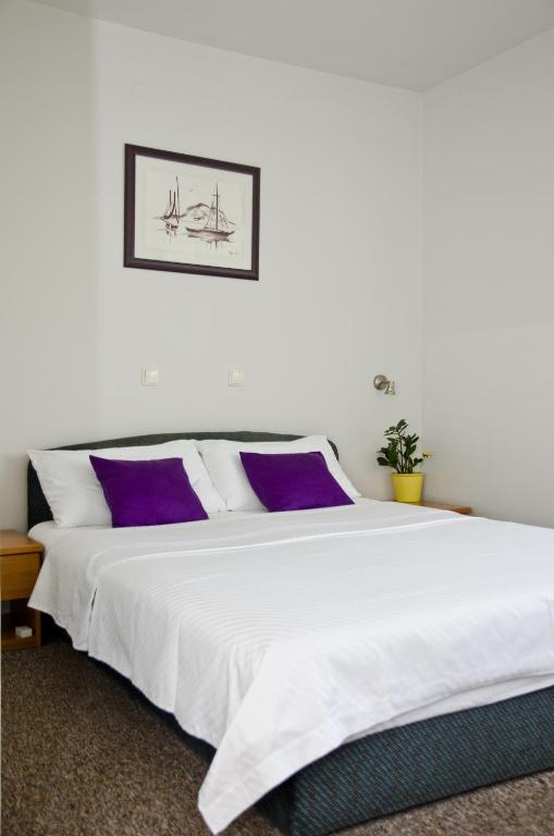 Postel nebo postele na pokoji v ubytování Hotel Fala Zagreb