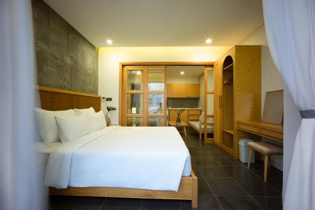 Giường trong phòng chung tại LIVIE Da Nang An Thuong